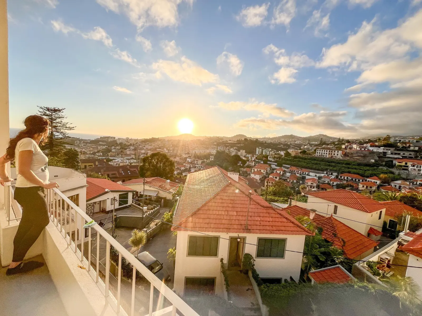 Resident on the balcony watching the sun set over Funchal