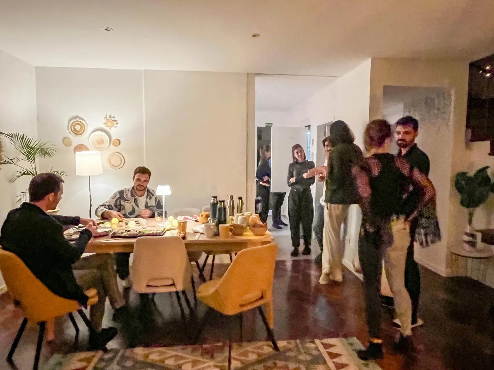Residents and friends gathering for dinner in the living room