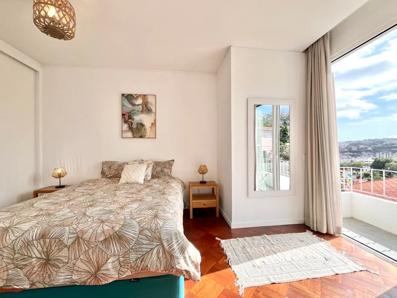 Room 3: double bedroom with floor-to-ceiling window onto a sea-view balcony